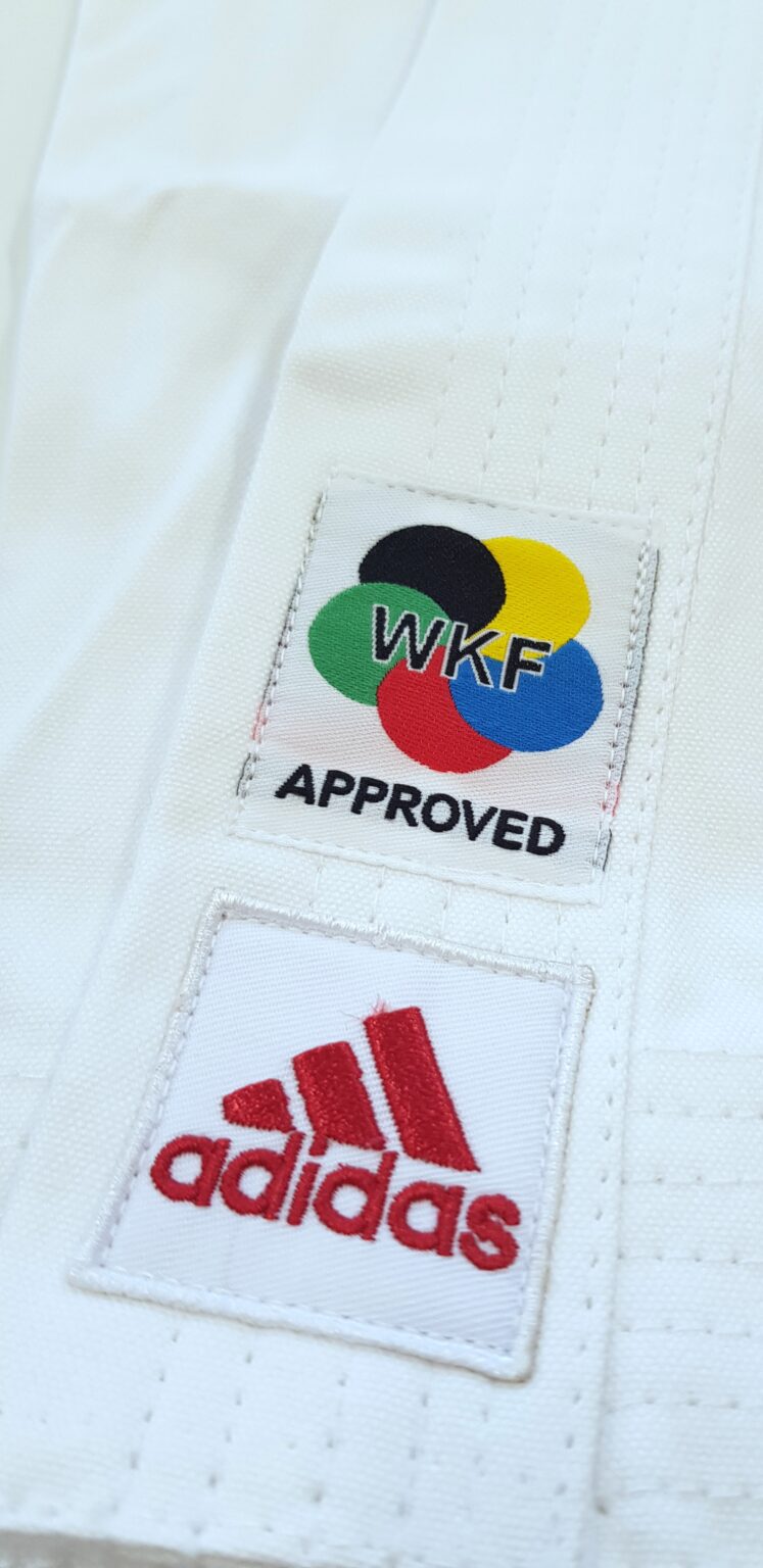 karate uniform with red logo