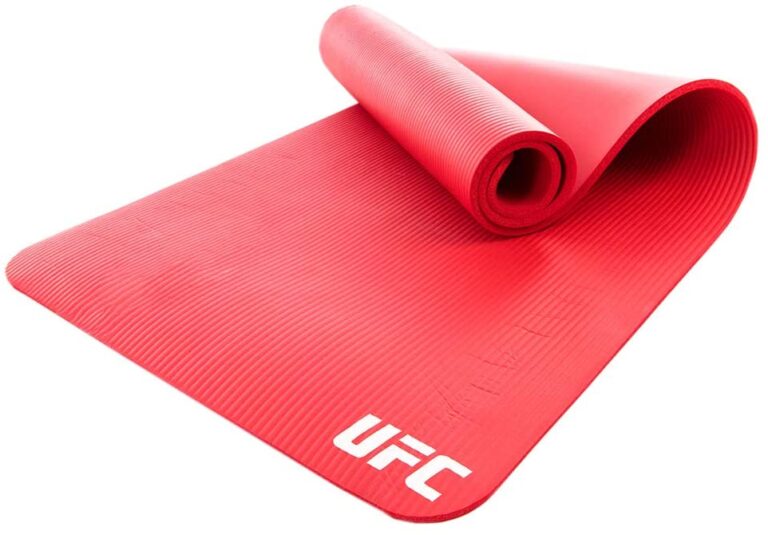 This bold Red UFC training mat is an essential fitness tool perfect for multiple uses. The portability and durability of this mat allow you to work out nearly anywhere at any time and store it when not in use. Helping to provide stability and added cushion, it allows you to comfortably perform numerous exercises including sit-ups, push-ups, burpees, and Planks. The non-slip textured surface, soft yet durable design and convenient carry strap combine for a superior training mat.