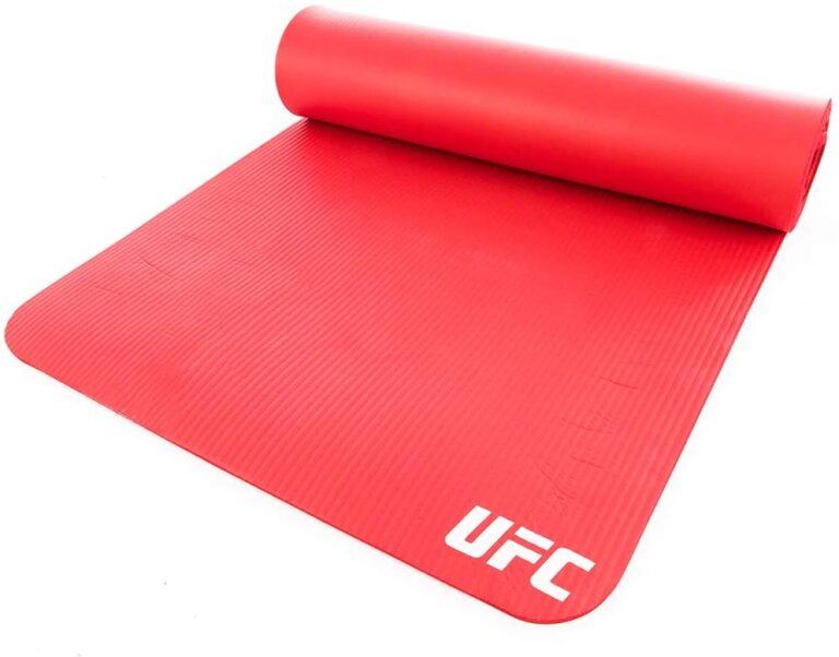 This bold Red UFC training mat is an essential fitness tool perfect for multiple uses. The portability and durability of this mat allow you to work out nearly anywhere at any time and store it when not in use. Helping to provide stability and added cushion, it allows you to comfortably perform numerous exercises including sit-ups, push-ups, burpees, and Planks. The non-slip textured surface, soft yet durable design and convenient carry strap combine for a superior training mat.